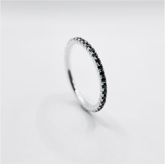 Black diamonds set in a micro pave wedding band stackable ring mauni london